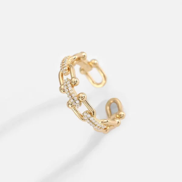 Close-up of Orek Catena Lock Chain Ring ring detail, a U-shaped lock-and-chain detail lined w