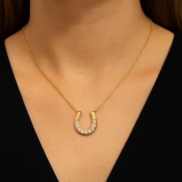 Woman wearing Orek Evara Horseshoe Necklace necklace
