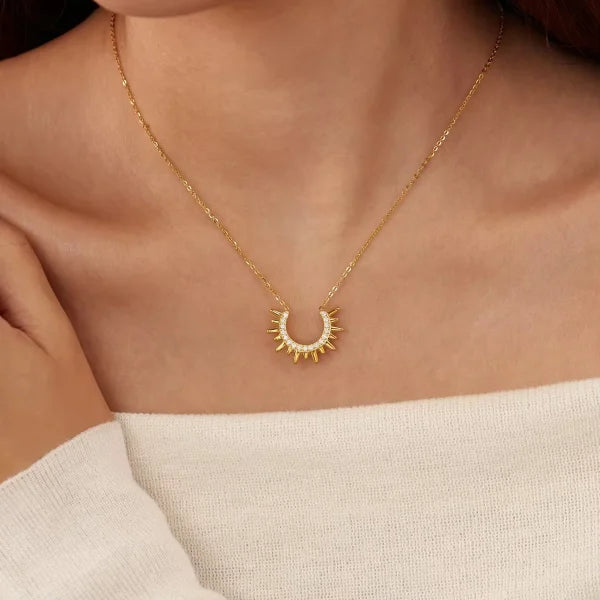 Woman wearing Orek Sunburst Charm Radiant Rise Necklace necklace