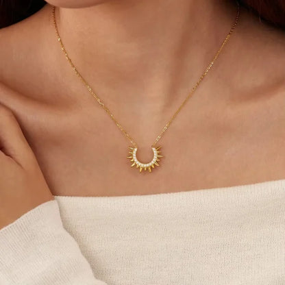 Woman wearing Orek Sunburst Charm Radiant Rise Necklace necklace