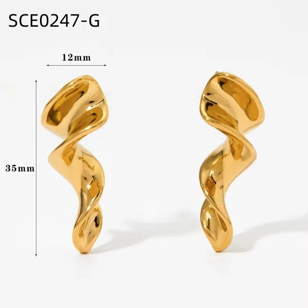 Orek Nyra Twisted Chunky Earrings earrings on jewellery display, an irregular, twisted silhouette with a 