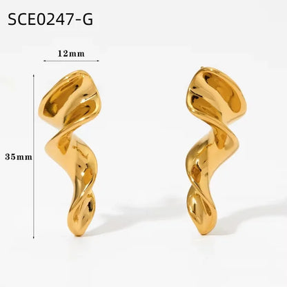 Orek Nyra Twisted Chunky Earrings earrings on jewellery display, an irregular, twisted silhouette with a 