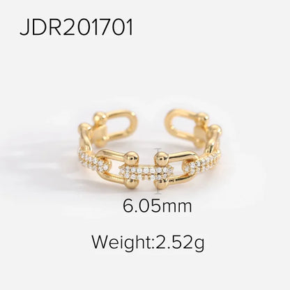 Orek Catena Lock Chain Ring ring on jewellery display, a U-shaped lock-and-chain detail lined w