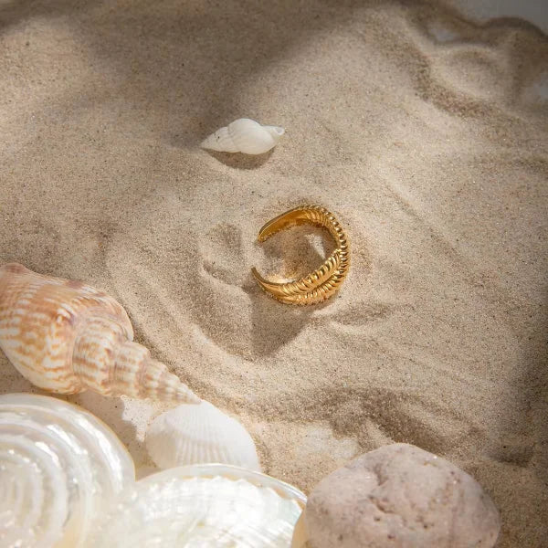 Woman wearing Orek Conch Cross Ring ring
