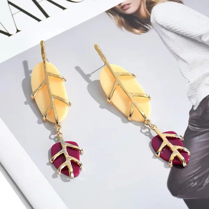 Close-up of Orek Solene Boho Leaf Dangler earrings detail, a casual, resin-accented leaf silhouette