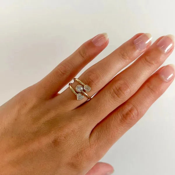 Close-up of Orek Triora Layered Heart Ring ring detail, three hollowed heart layers stacked toge