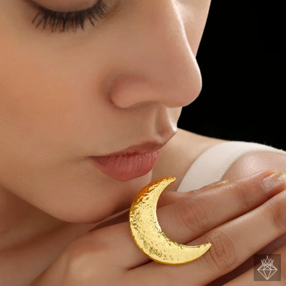 Close-up of Orek Selene Big Moon Ring ring detail, a bold, irregular crescent-moon silhouet