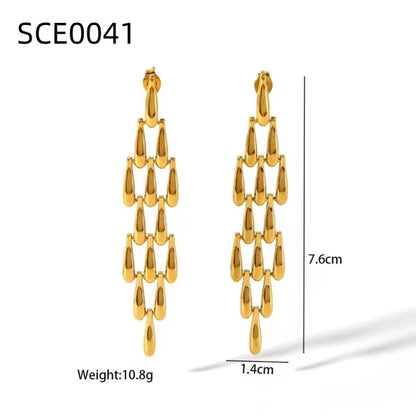 Close-up of Orek Woven Tassel Drop Earrings earrings detail, a long, woven tassel that sways with mov