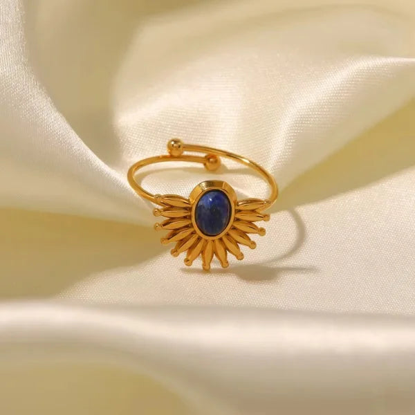 Close-up of Orek Evara Blue Ring ring detail, a bold open band set with a rich lapis l