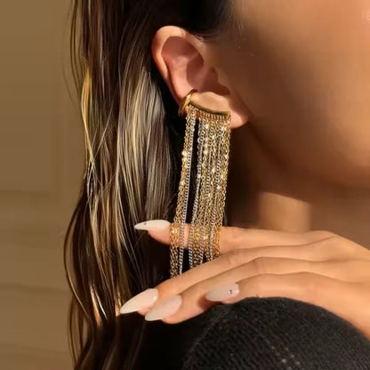 Woman wearing Orek Arelia Mono Fringe Cuff earrings