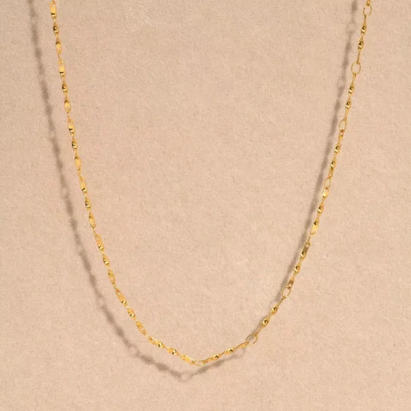 Close-up of Orek Kova Infinite Loop Necklace, showing anti-tarnish gold plated finish