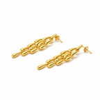 Close-up of Orek Woven Tassel Drop Earrings earrings detail, a long, woven tassel that sways with mov