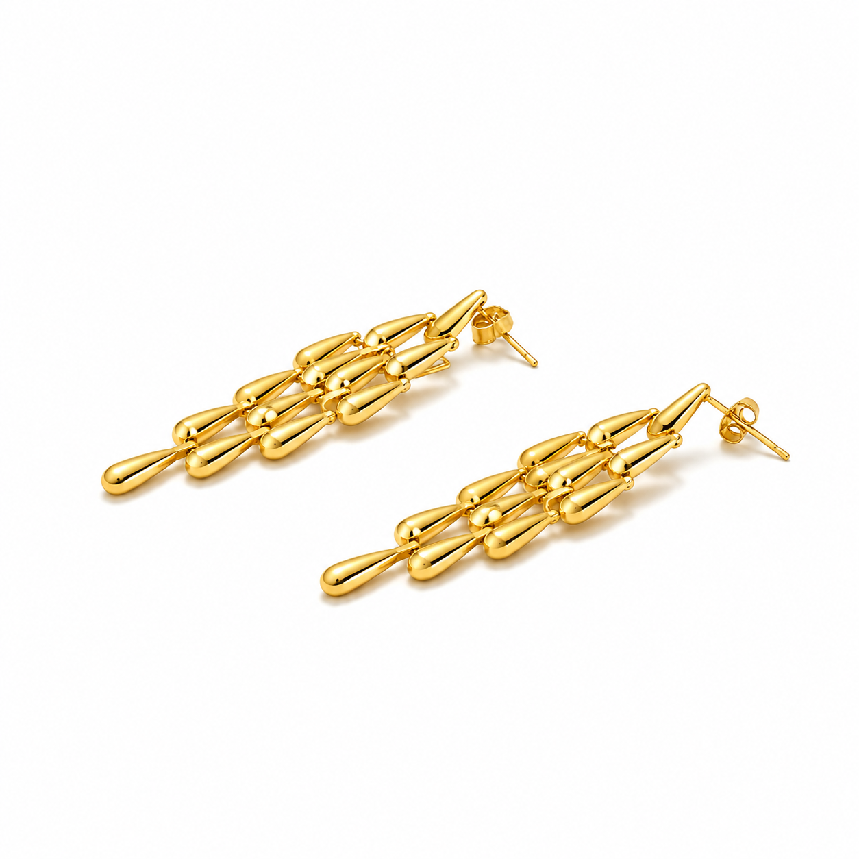 Close-up of Orek Woven Tassel Drop Earrings earrings detail, a long, woven tassel that sways with mov