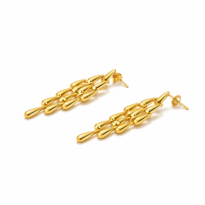 Close-up of Orek Woven Tassel Drop Earrings earrings detail, a long, woven tassel that sways with mov