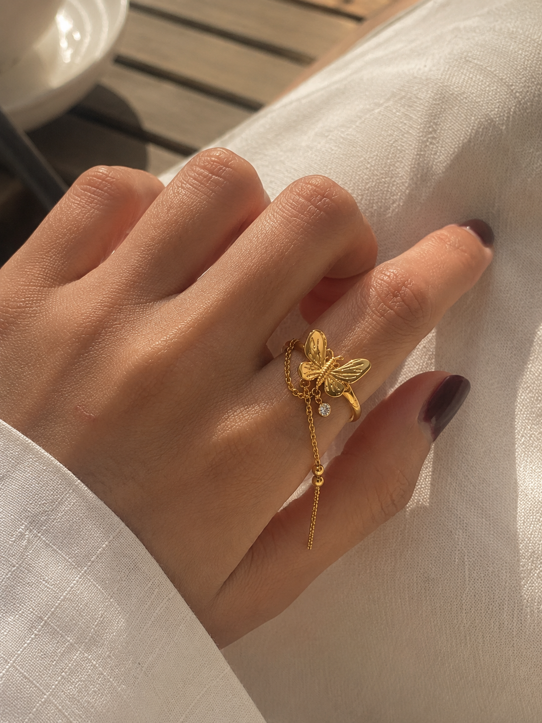Orek Aiera Butterfly Ring ring on jewellery display, a French vintage-inspired leaf silhouett