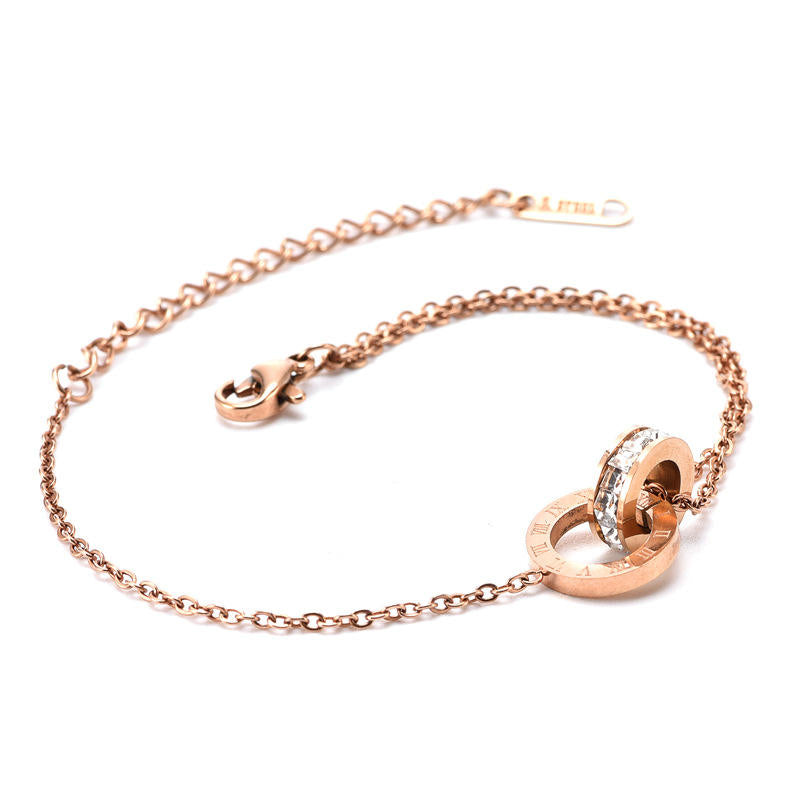 Close-up of Orek Infina Crystal Circle Bracelet bracelet detail, a crystal charm set inside an infinity c