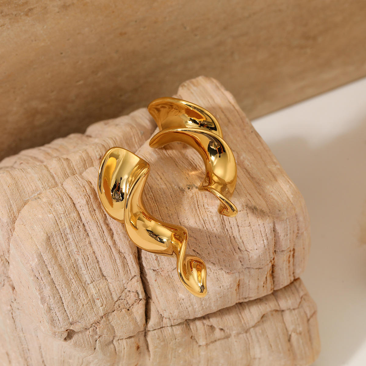 Woman wearing Orek Nyra Twisted Chunky Earrings earrings