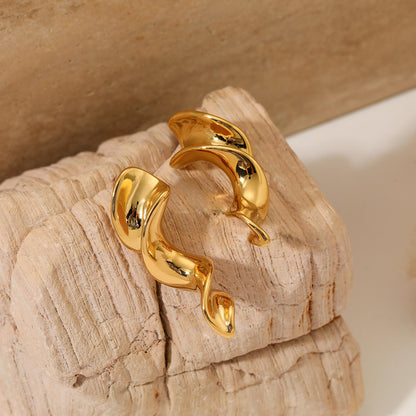 Woman wearing Orek Nyra Twisted Chunky Earrings earrings