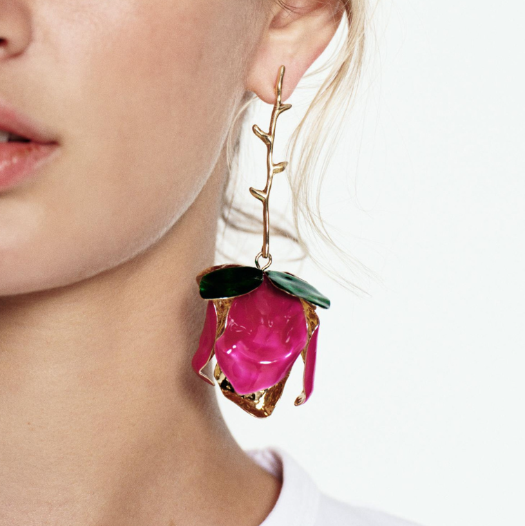 Close-up of Orek Solene Metallic Rose Dangler earrings detail, a sculpted metallic rose in full bloom