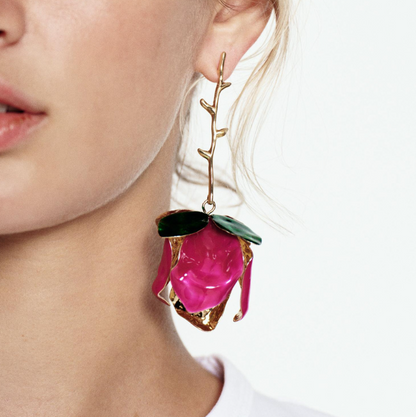 Close-up of Orek Solene Metallic Rose Dangler earrings detail, a sculpted metallic rose in full bloom