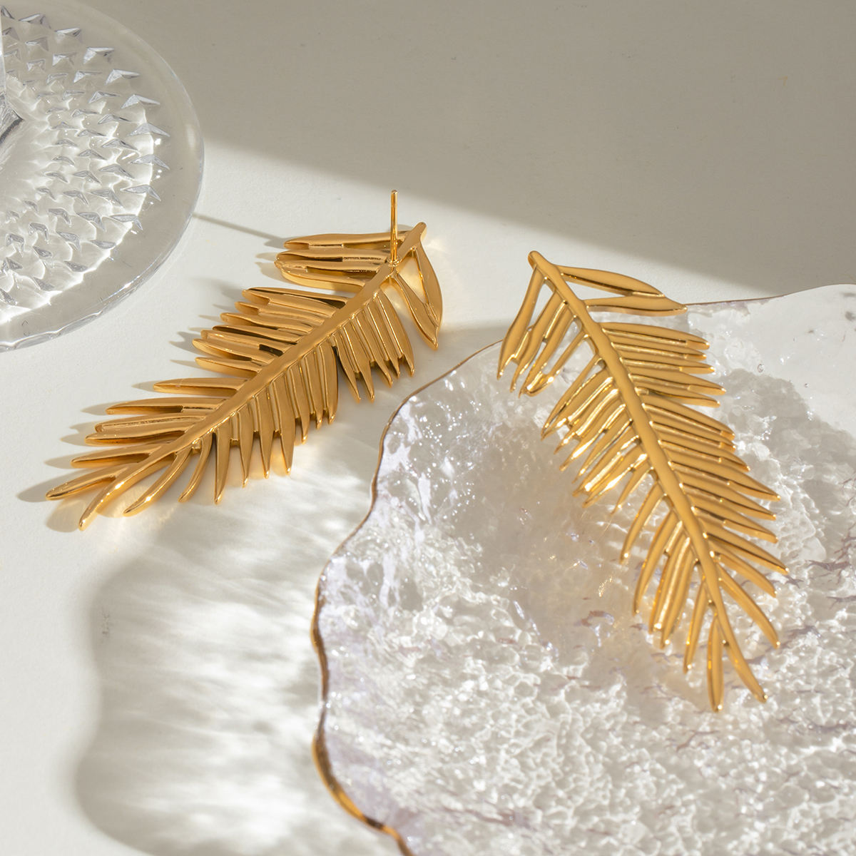 Close-up of Orek Harmony Leaf Pair Earrings earrings detail, a pair of European-inspired leaf silhoue