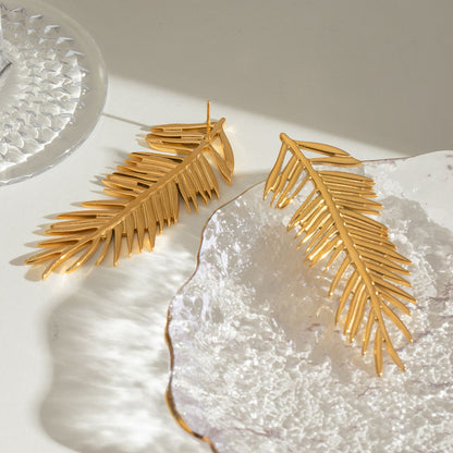 Close-up of Orek Harmony Leaf Pair Earrings earrings detail, a pair of European-inspired leaf silhoue