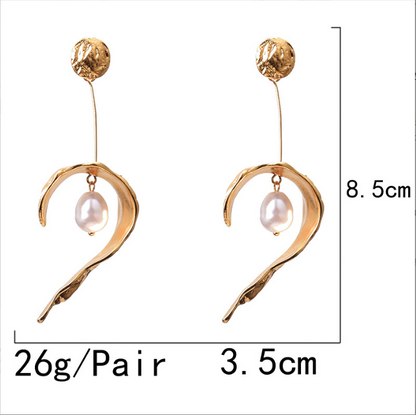 Woman wearing Orek Arelia Long Grace Dangler earrings