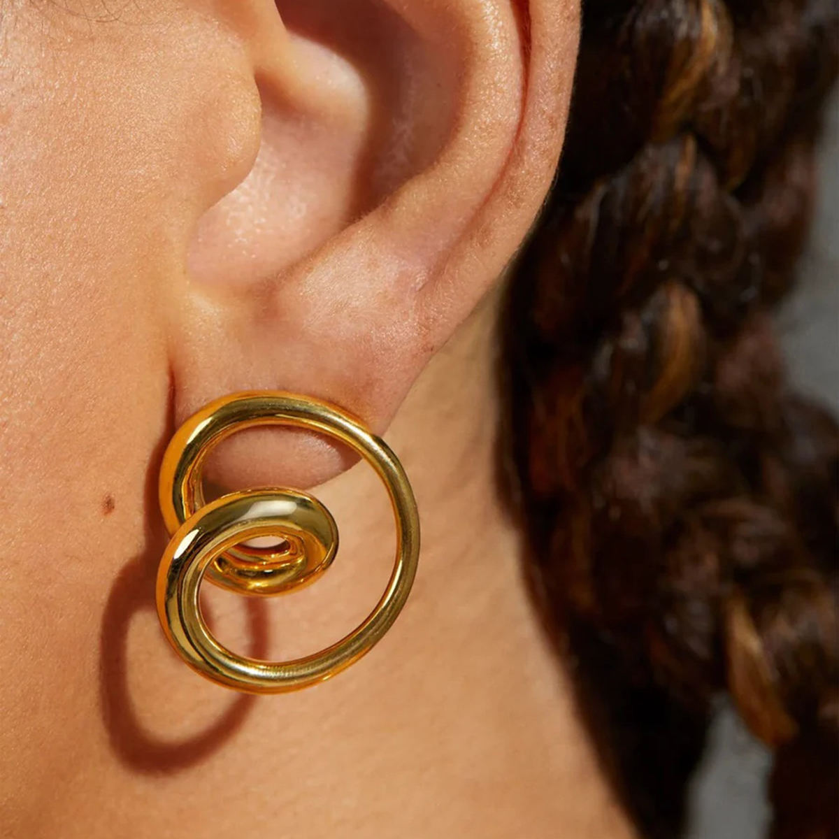 Woman wearing Orek Eternal Love Spin Earrings earrings