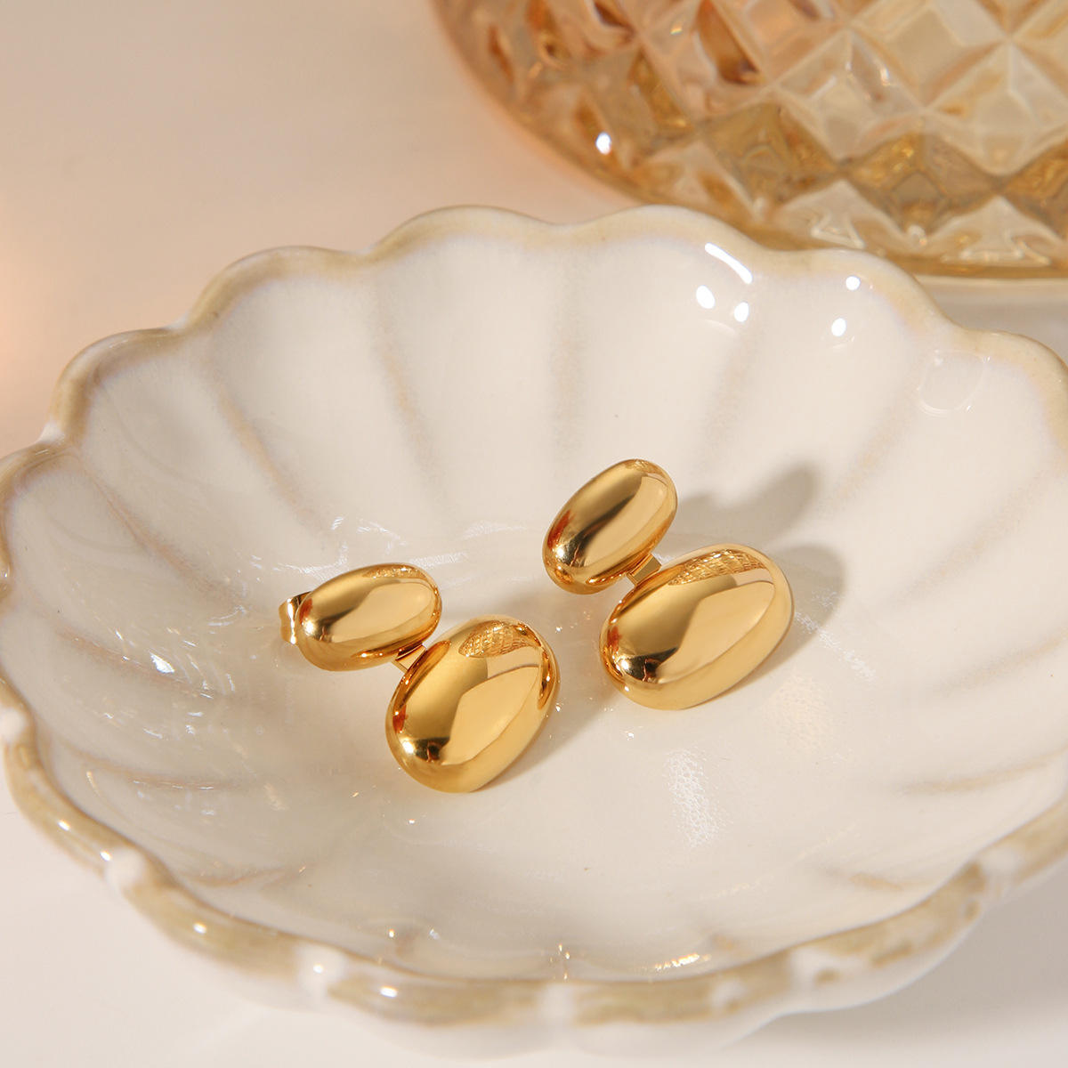 Orek Evra Smooth Glassy Vintage Studs earrings on jewellery display, a slightly larger, high-polish glass-lik