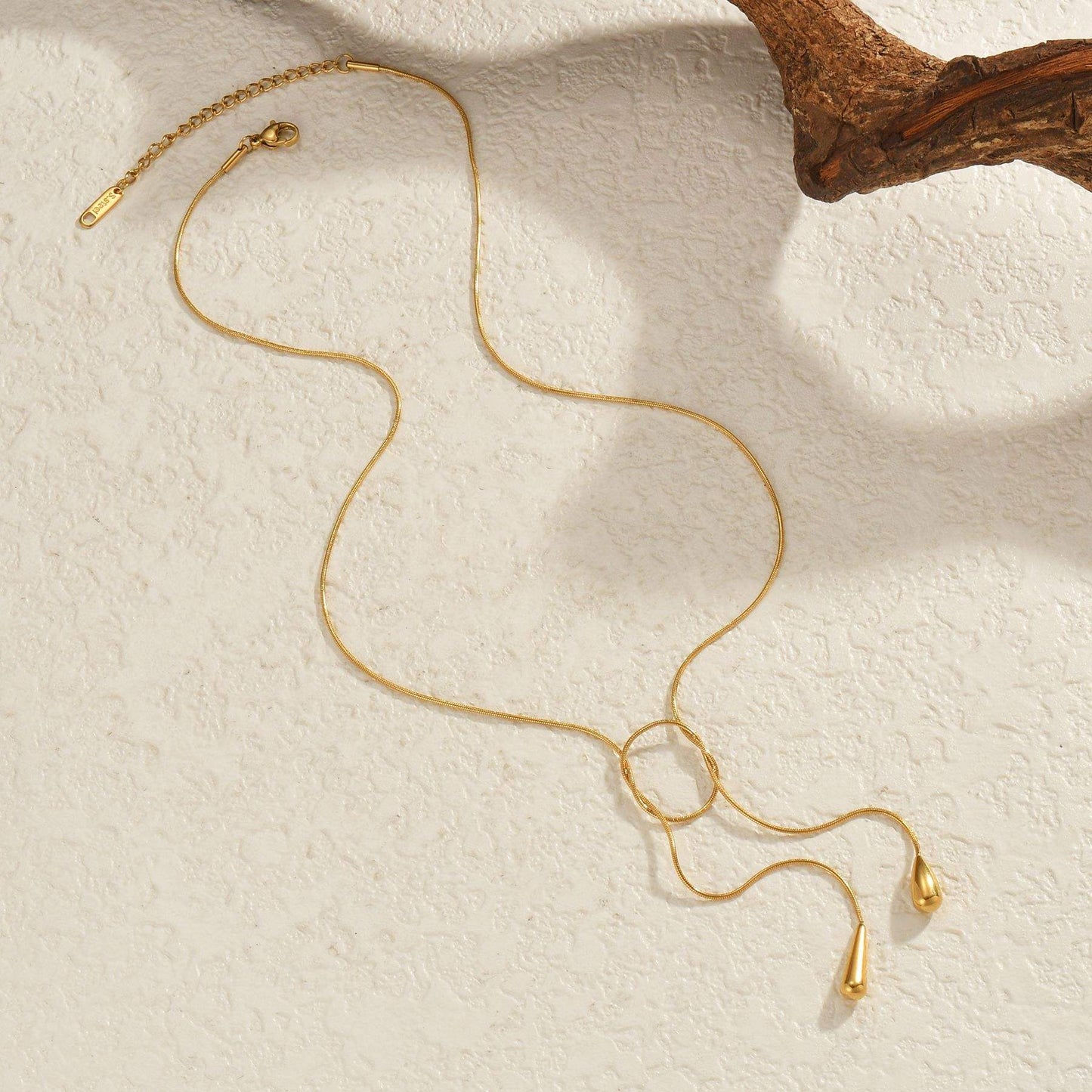 Woman wearing Orek Evara Loop Drop Necklace necklace