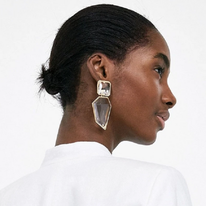 Woman wearing Orek Oria Quiet Geometry Dangler earrings