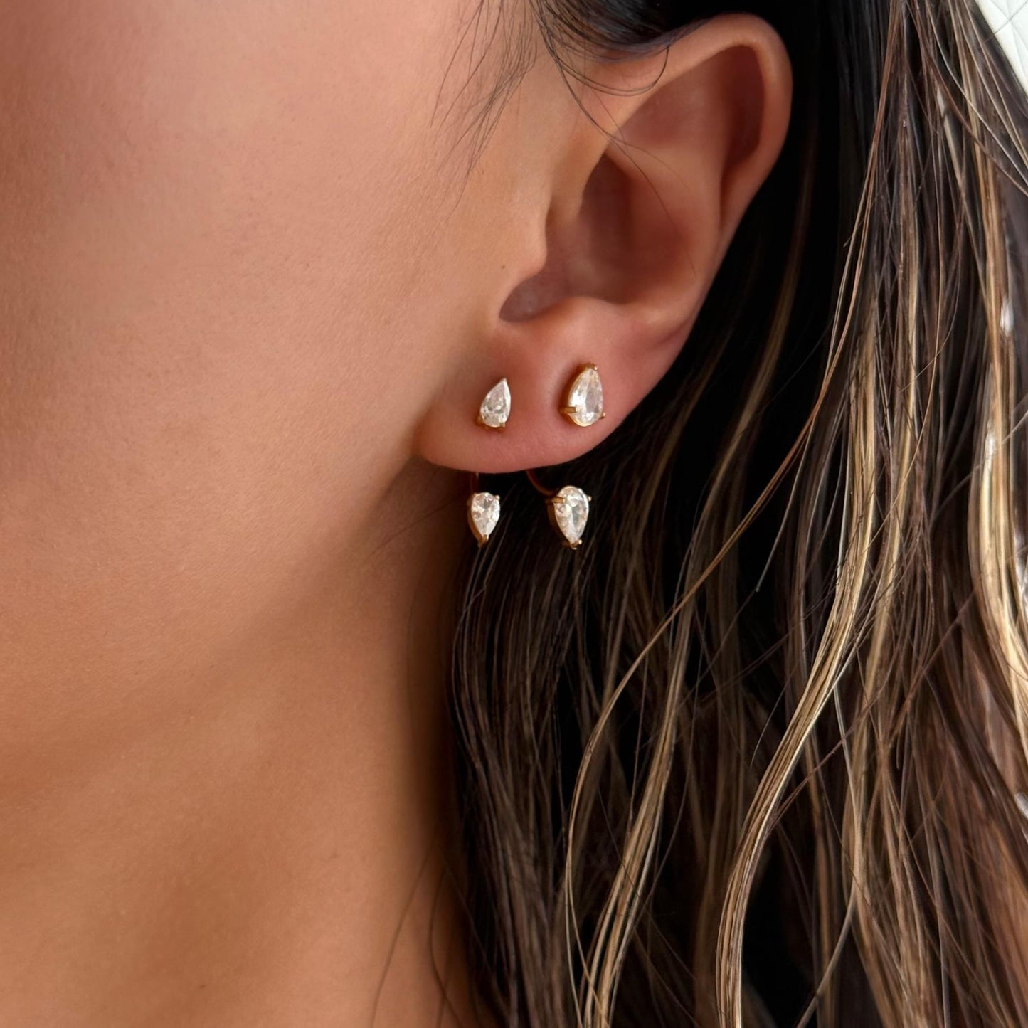 Woman wearing Orek Era Pear Crystal Studs earrings