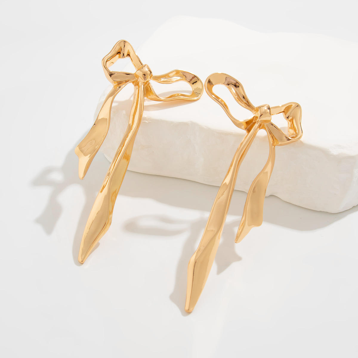 Orek Noira Bold Bow Dangler earrings styled with everyday outfit