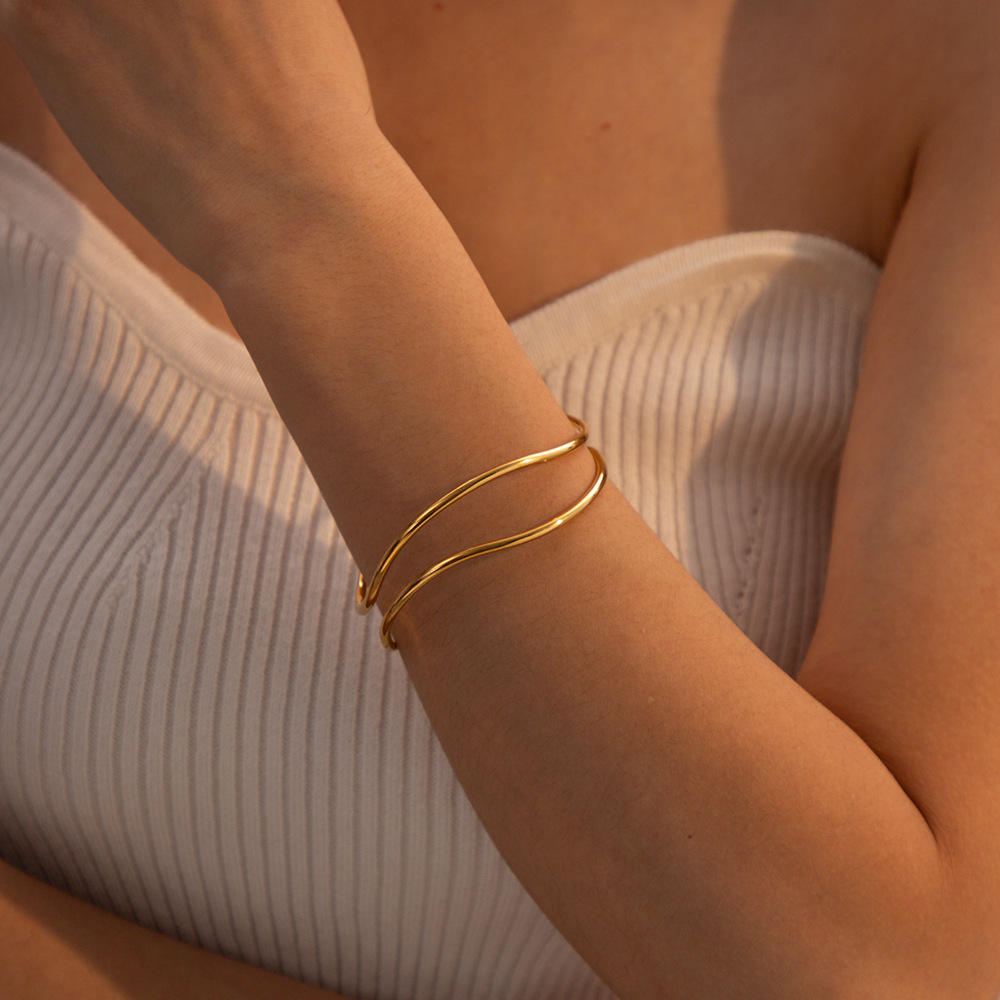 Close-up of Orek Arelia Double Layer Bangle bracelet detail, two slim, parallel lines forming a minim