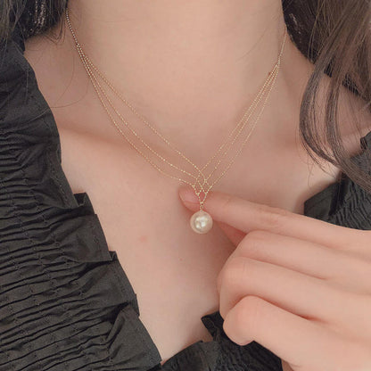 Close-up of Orek Luna Siren Pearl Necklace, showing anti-tarnish gold plated finish