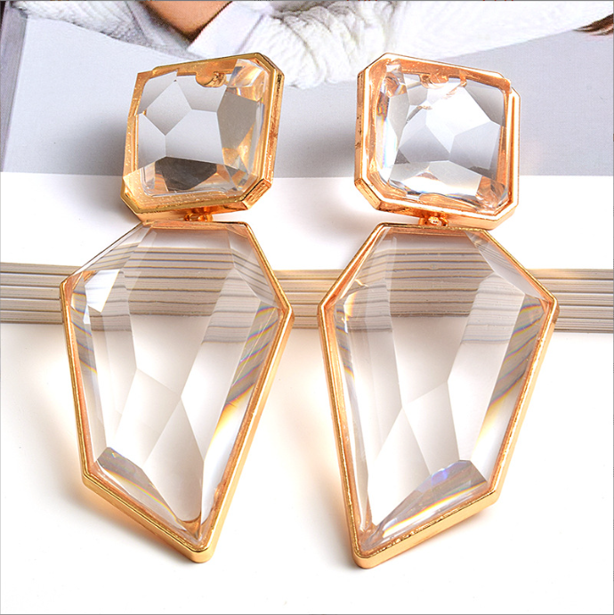 Orek Oria Quiet Geometry Dangler earrings on jewellery display, a clean, geometric silhouette in a soft 