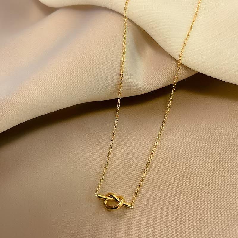 Orek Heart Love Knot Necklace necklace styled with everyday outfit