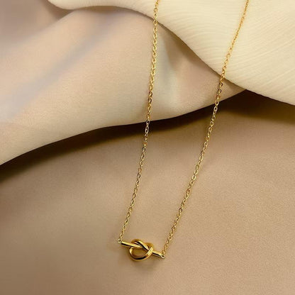 Orek Heart Love Knot Necklace necklace styled with everyday outfit