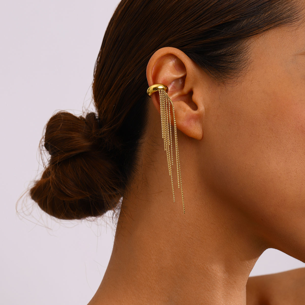 Close-up of Orek Elara Peace Tassel Cuff earrings detail, a sophisticated tassel drop worn as a si
