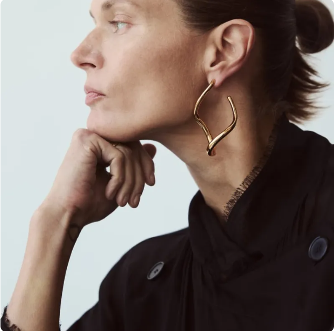 Woman wearing Orek Ciela Abstract Twist Dangler earrings