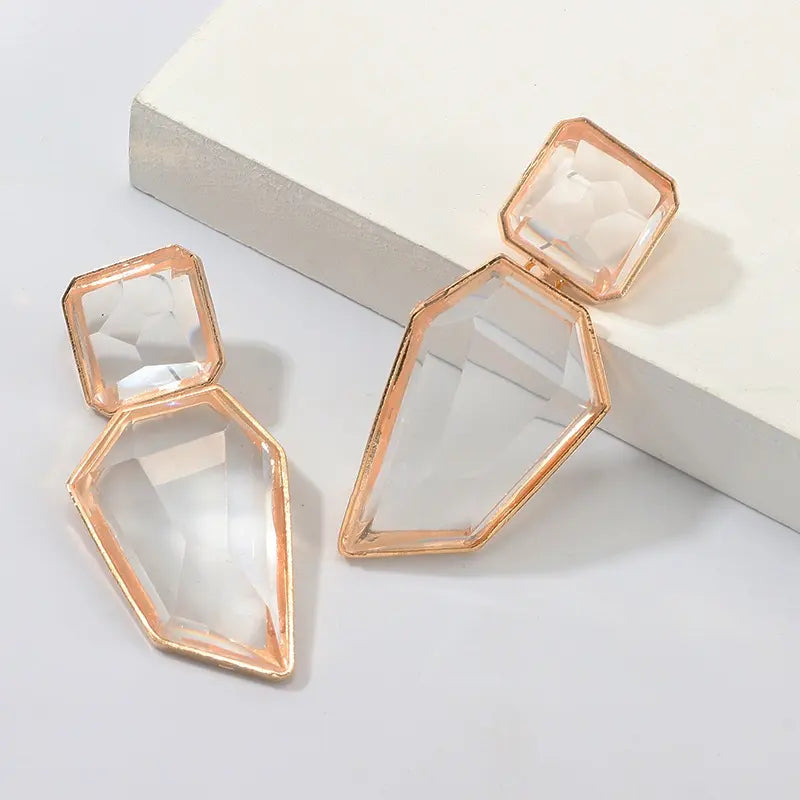 Close-up of Orek Oria Quiet Geometry Dangler earrings detail, a clean, geometric silhouette in a soft 