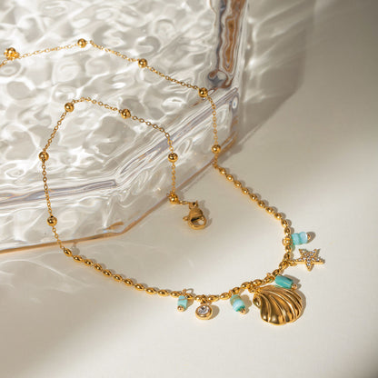 Orek Ciela Ocean Charm Necklace necklace on jewellery display, a shell charm paired with green beads, i