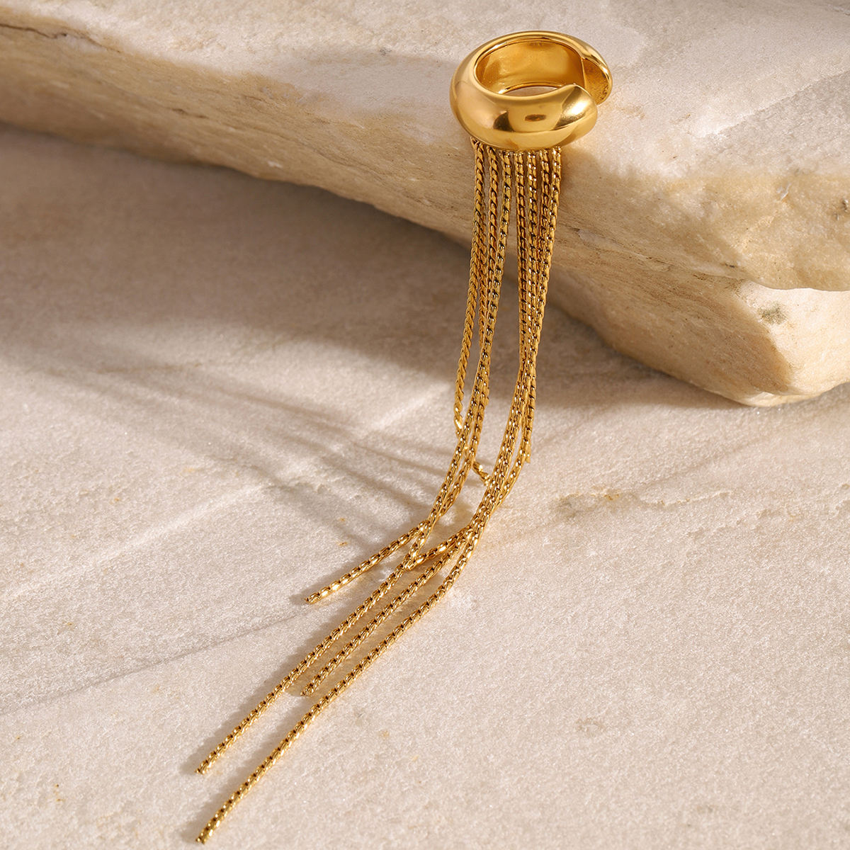 Woman wearing Orek Elara Peace Tassel Cuff earrings