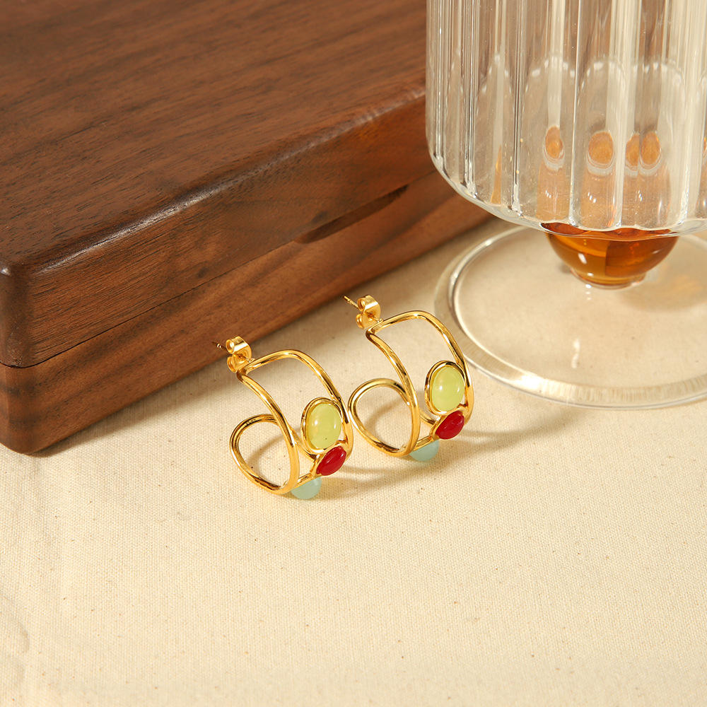 Orek Radiant Harmony Crystal Earrings earrings on jewellery display, a cluster of multicolour crystals set in
