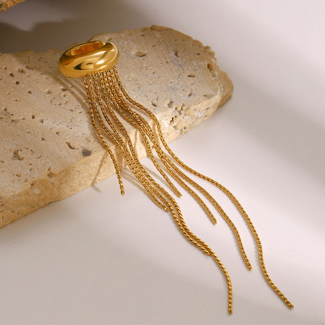 Orek Elara Peace Tassel Cuff earrings on jewellery display, a sophisticated tassel drop worn as a si