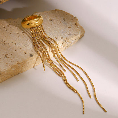 Orek Elara Peace Tassel Cuff earrings on jewellery display, a sophisticated tassel drop worn as a si