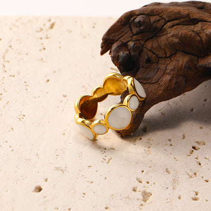 Close-up of Orek Strata Wide Band Ring ring detail, a wide, geometric band with clean, layer