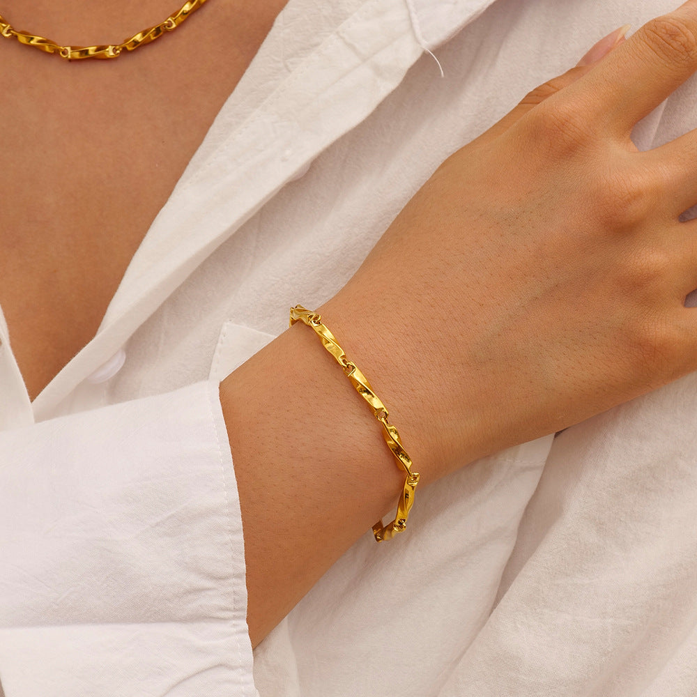 Woman wearing Orek Avira Mobius Bracelet bracelet