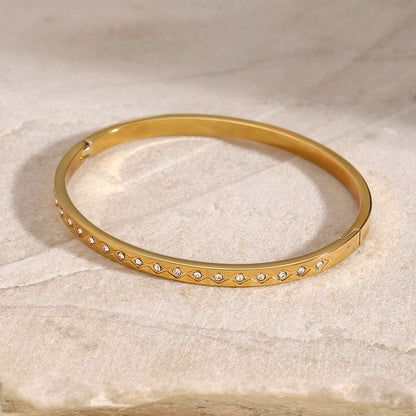 Orek Elyra Sparkle Clasp Bangle bracelet styled with everyday outfit