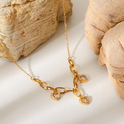 Woman wearing Orek Evara Heart Link Necklace necklace